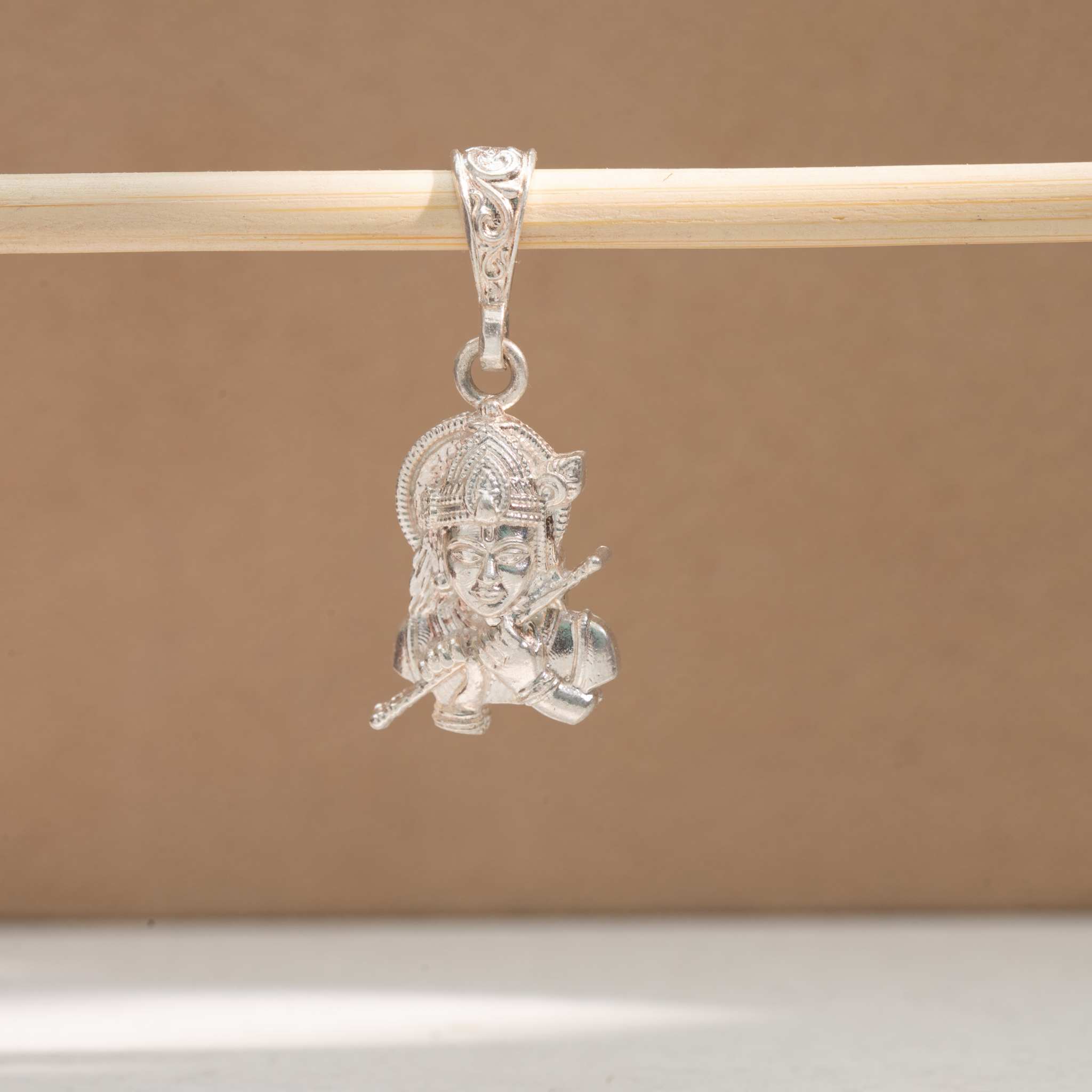 Silver Krishna pendant with flute design