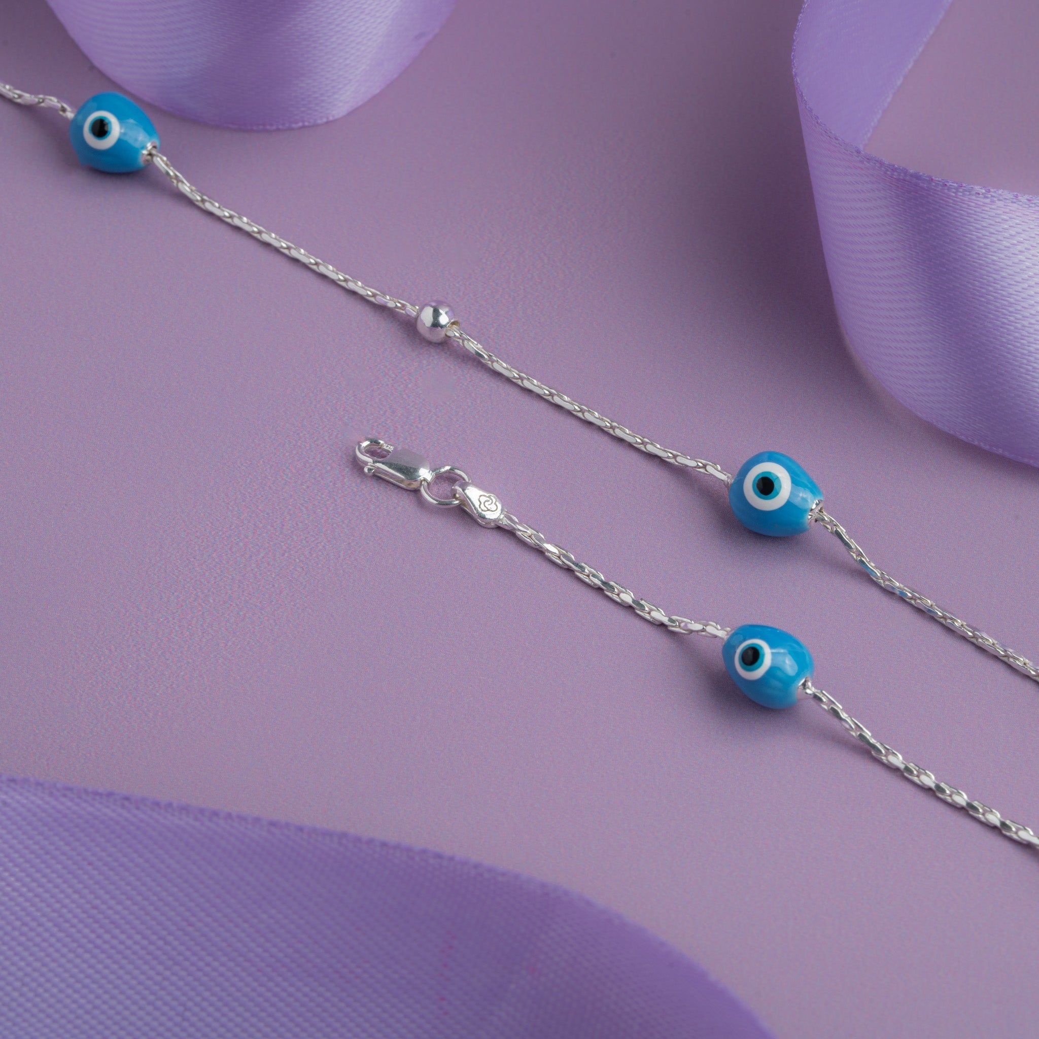 Silver anklet with blue evil eye beads 