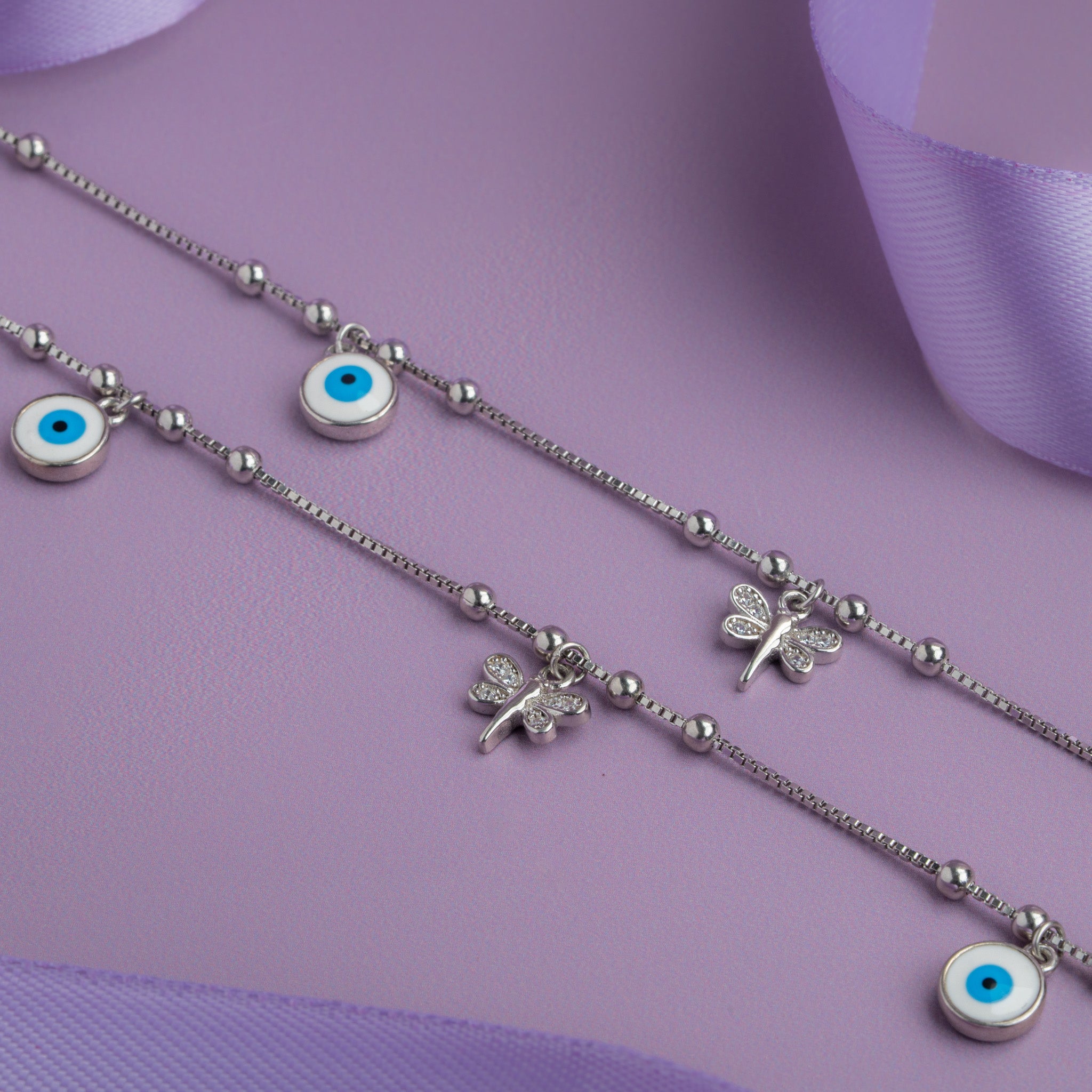 Silver anklet with blue evil eye charms 