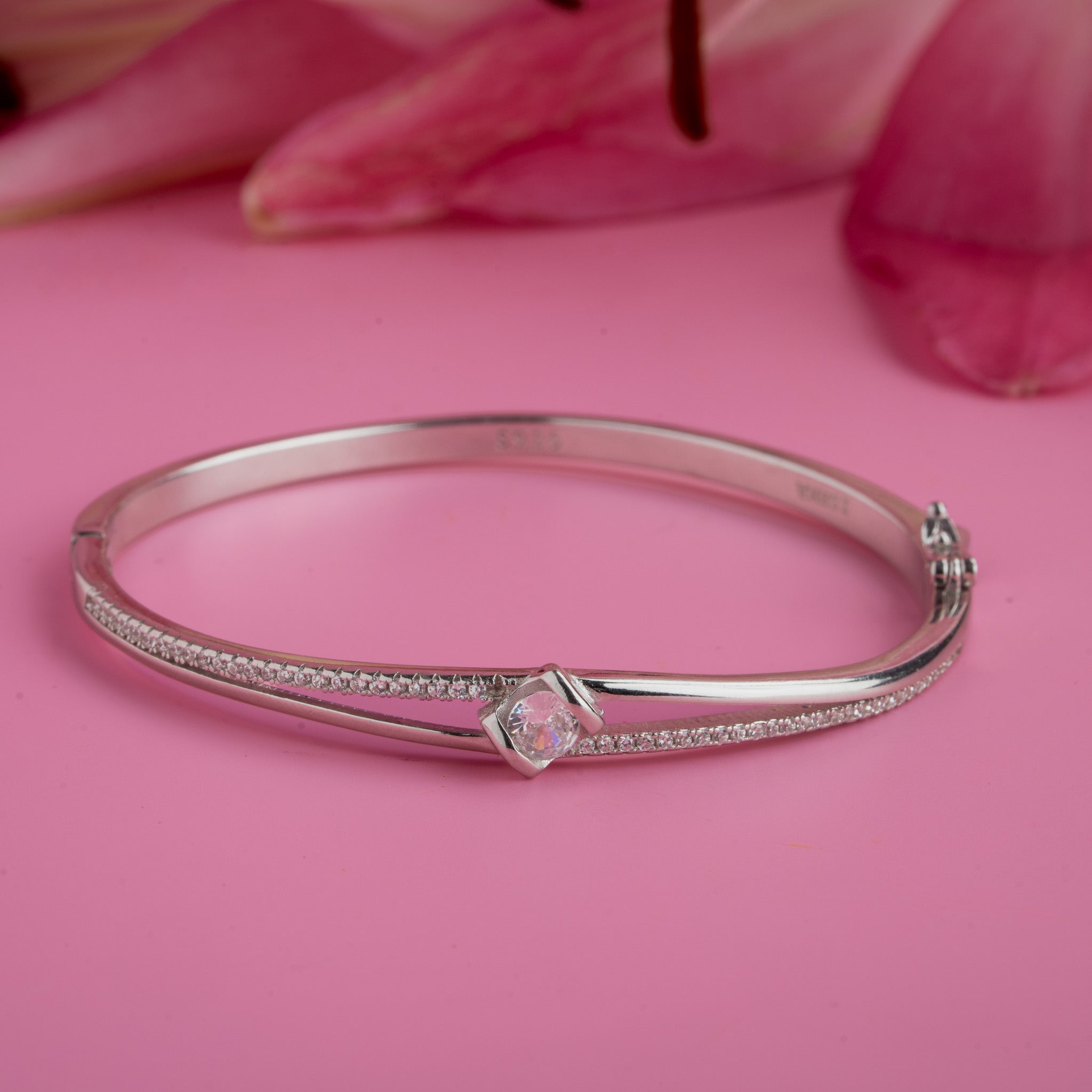 Silver bangle bracelet with solitaire stone