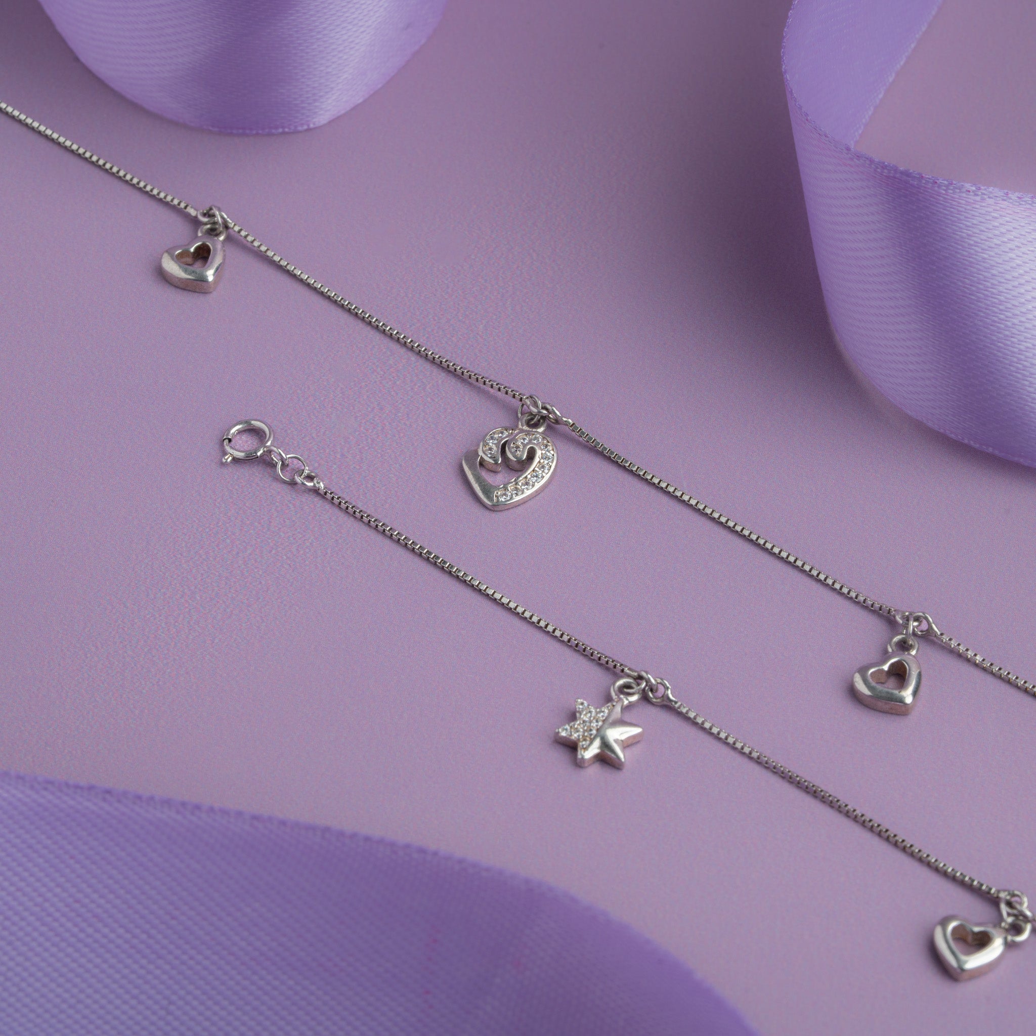 Silver charm anklet with heart and star charms