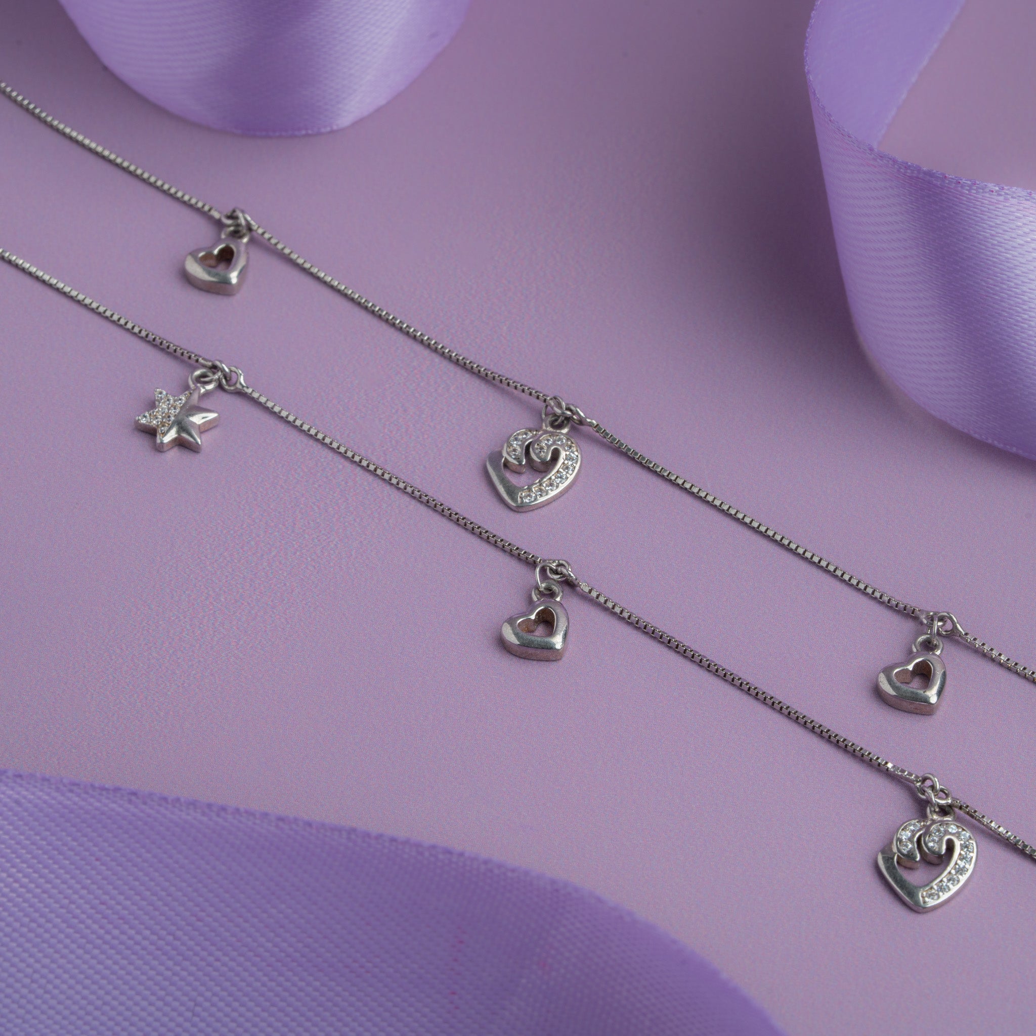 Silver charm anklet with heart and star pendants
