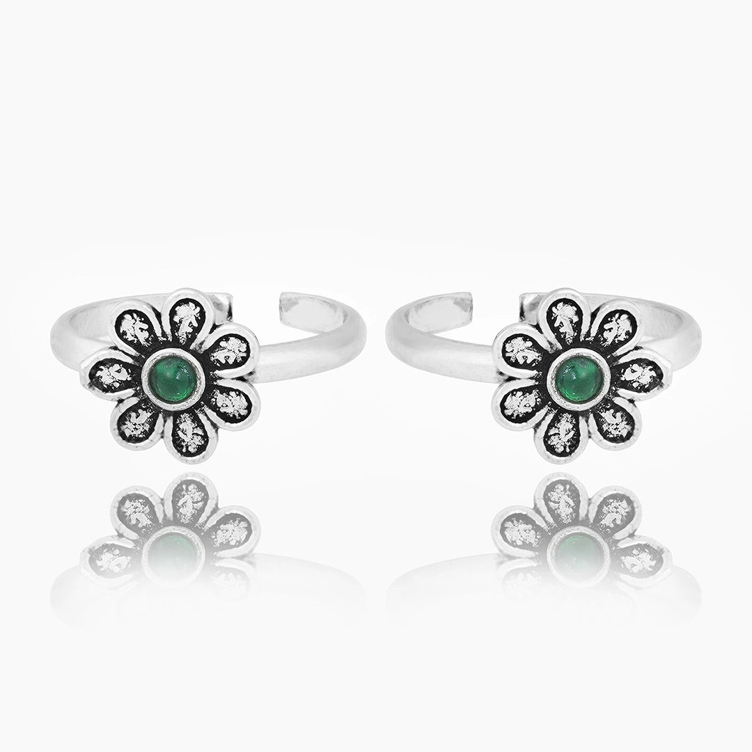 Silver floral toe ring with oxidised petal detailing  