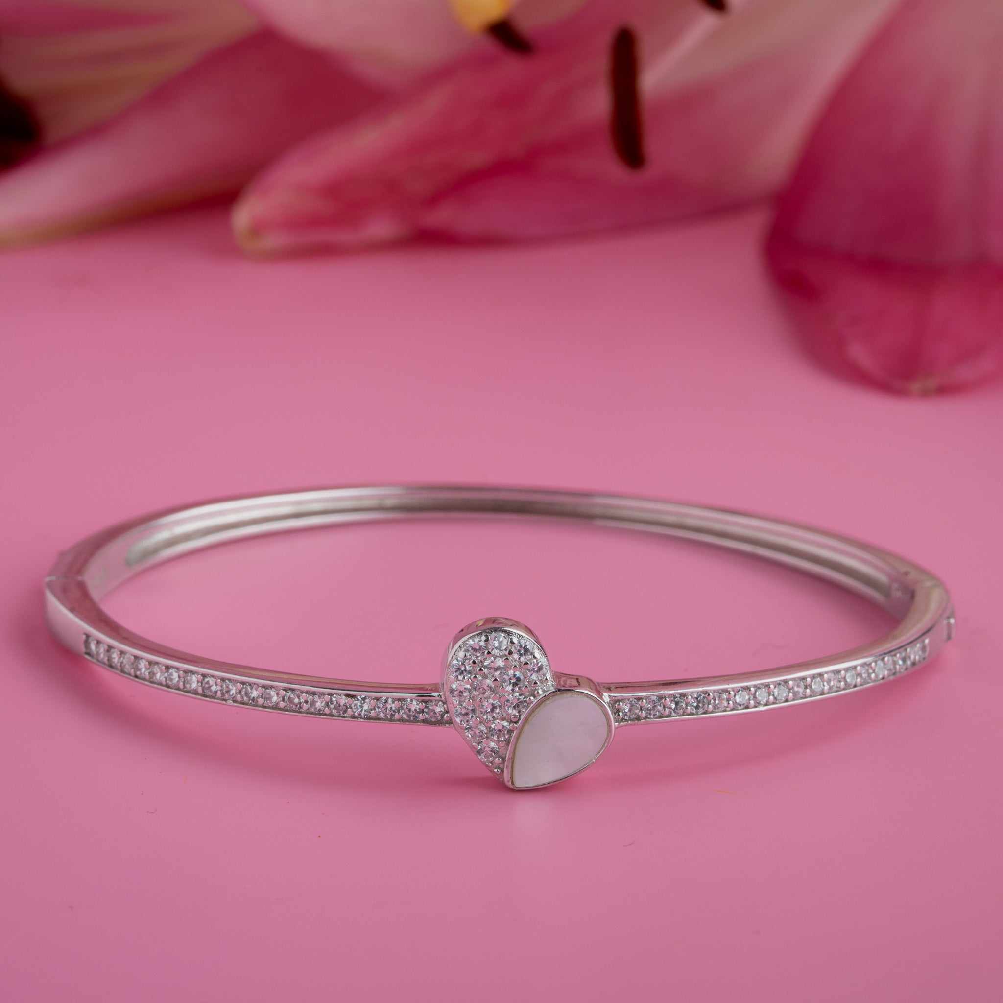 Silver heart bangle with stone detailing