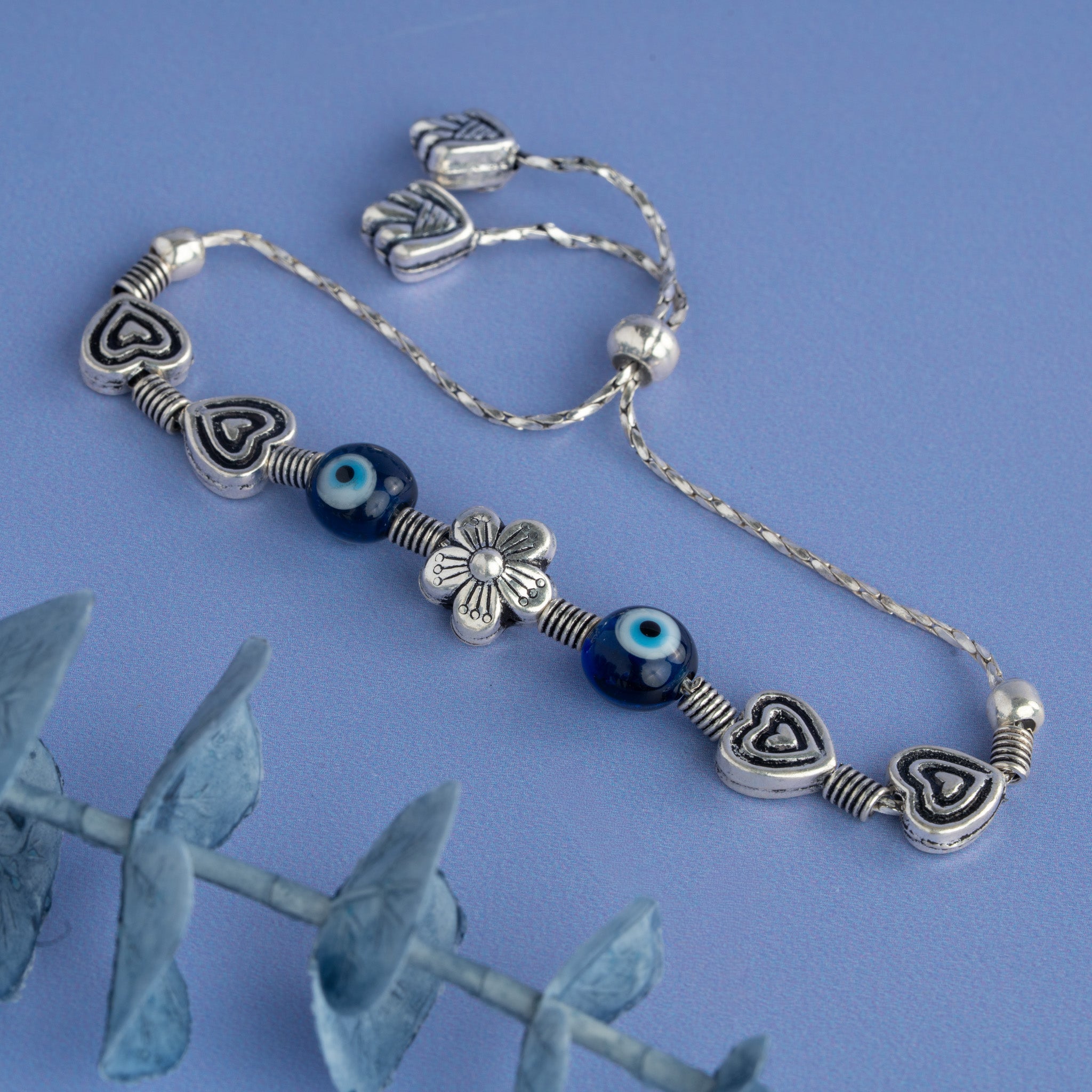 Silver heart bracelet with evil eye beads