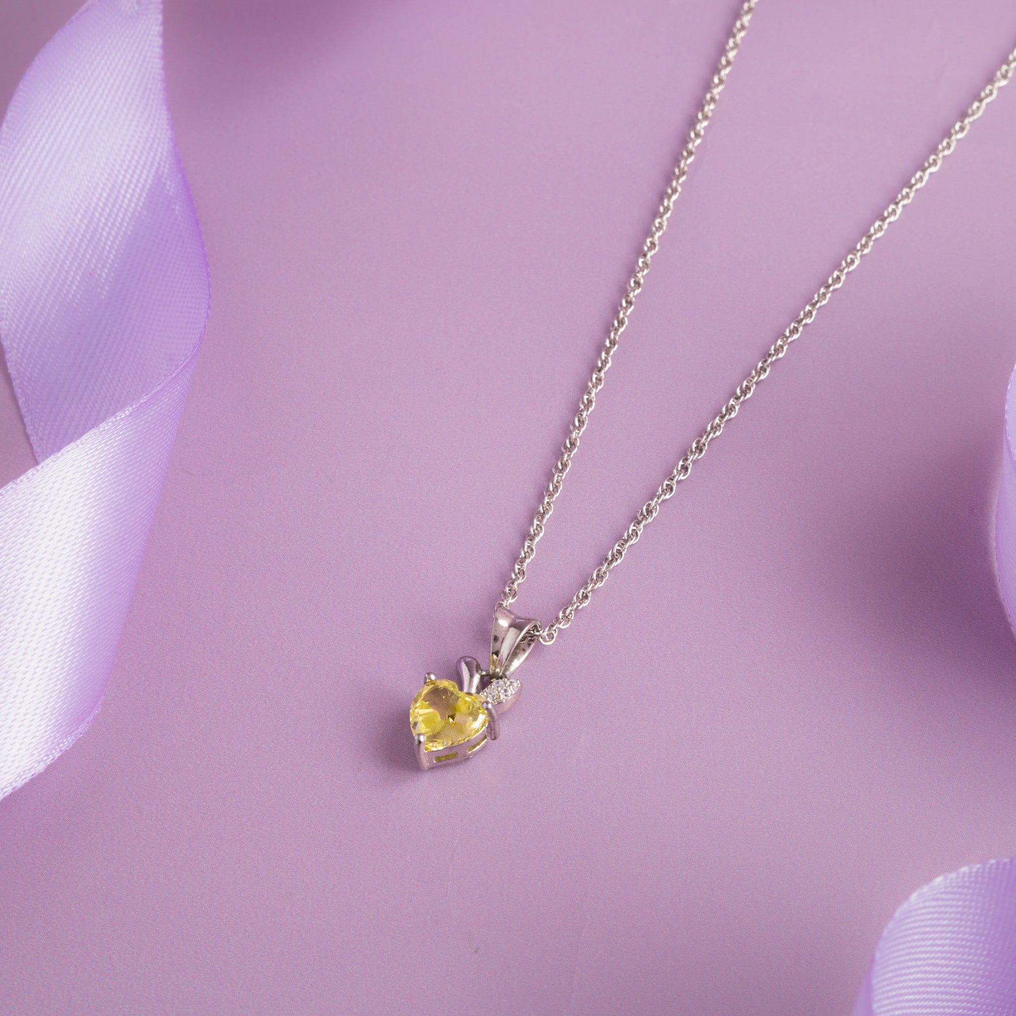 Silver heart pendant chain with yellow crystal stone