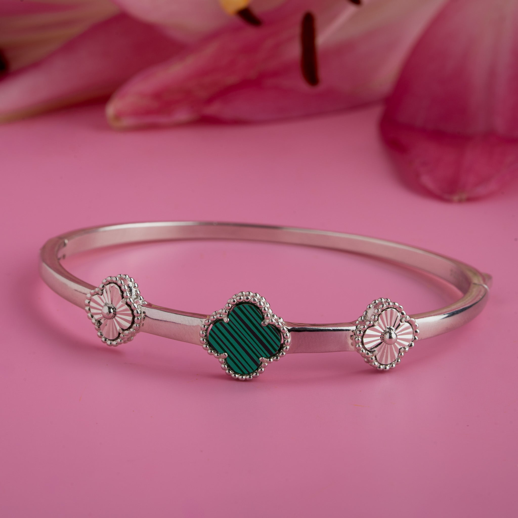 Silver kada with green clover design
