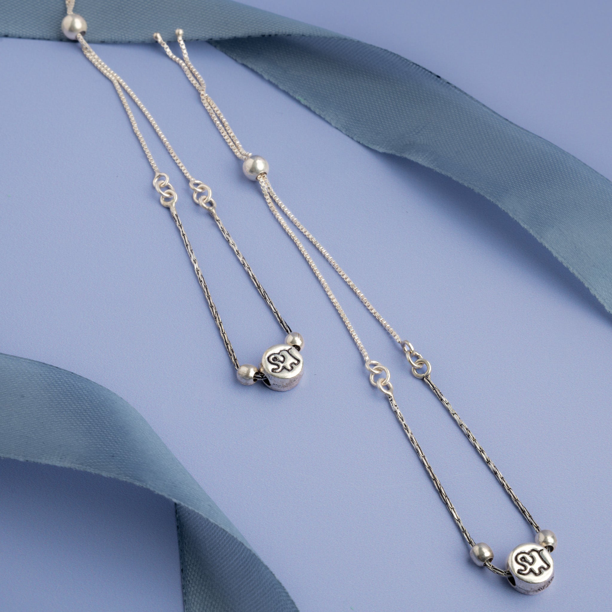 Silver layered anklet with engraved charm 