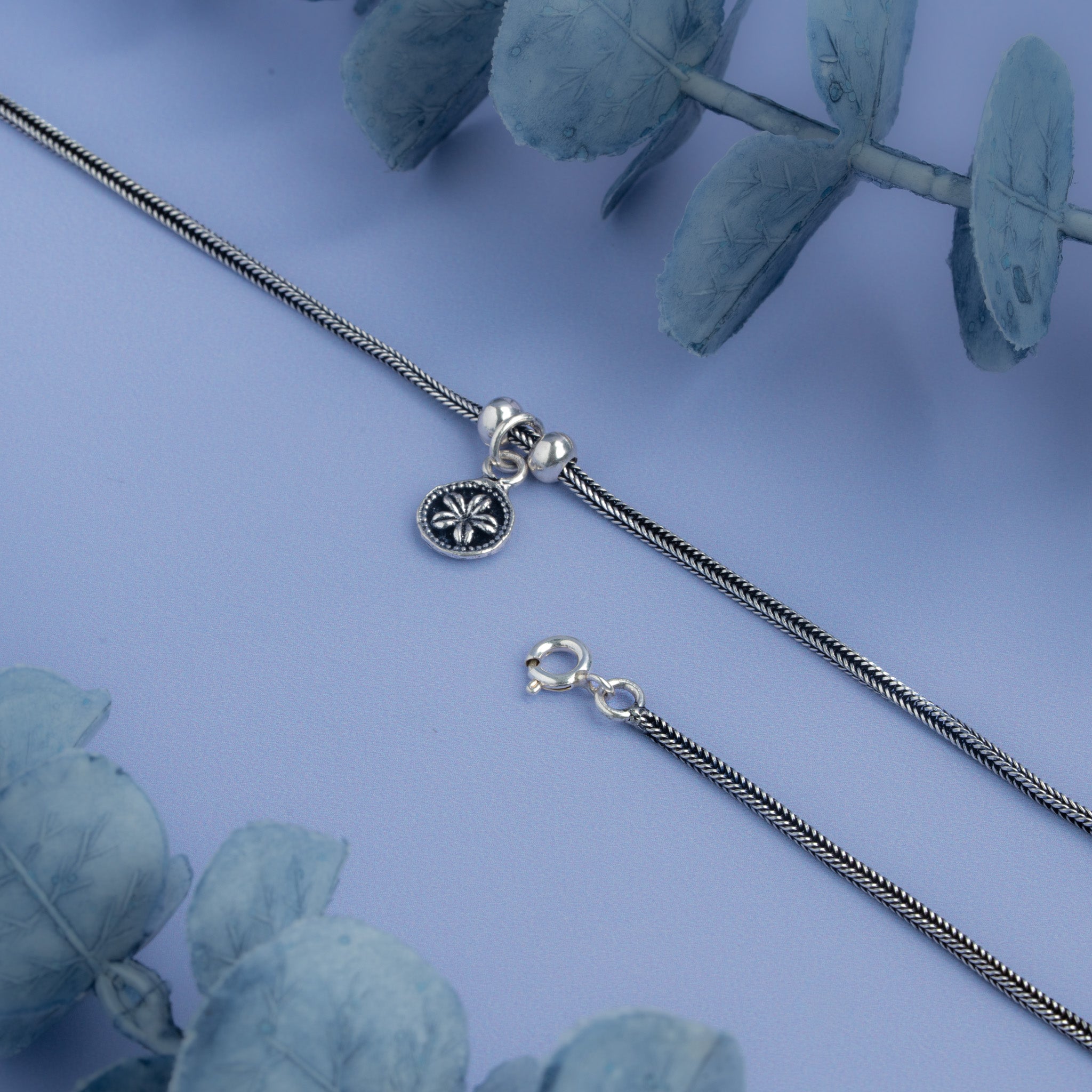 Silver snake chain anklet with floral coin charm 