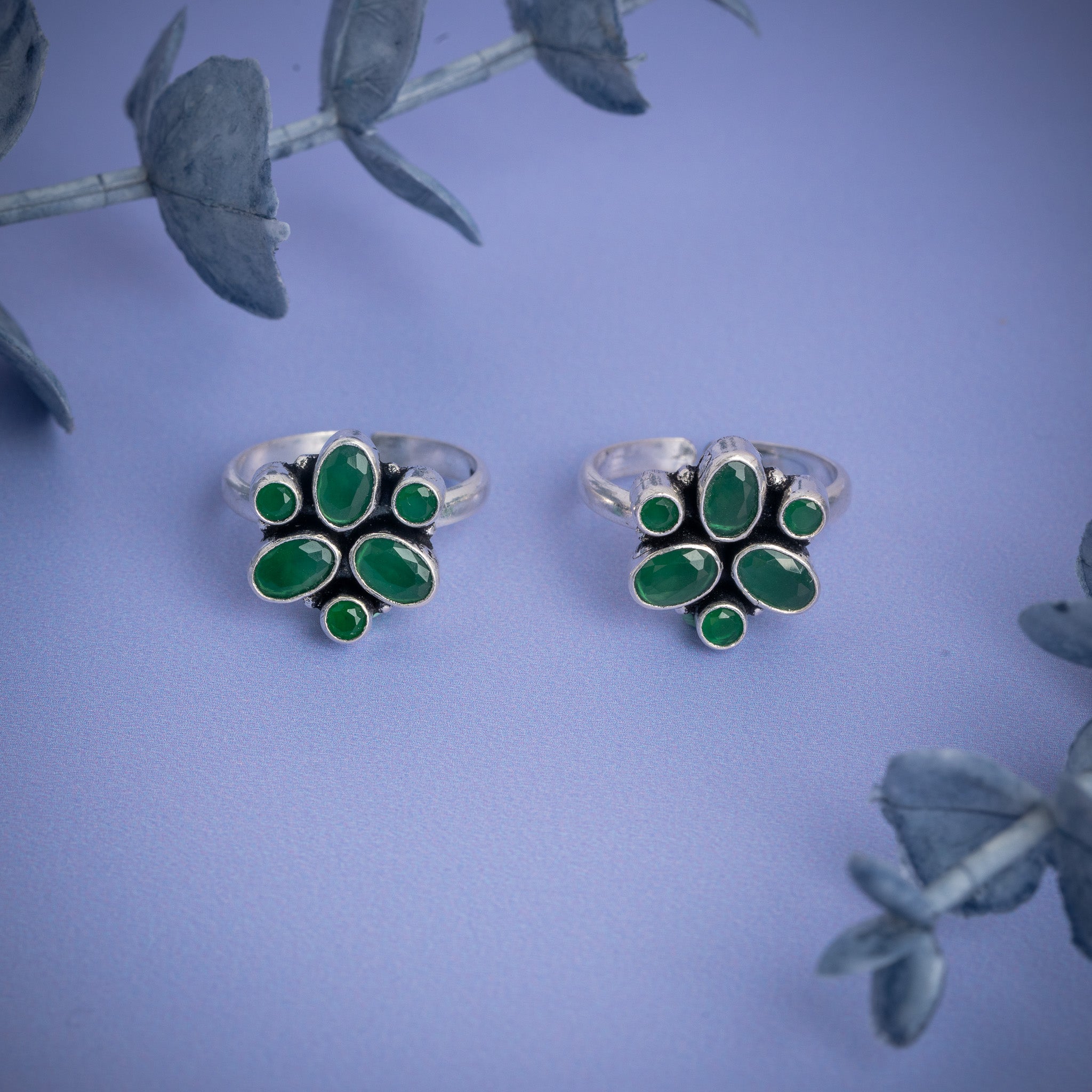 Silver toe rings with green stones