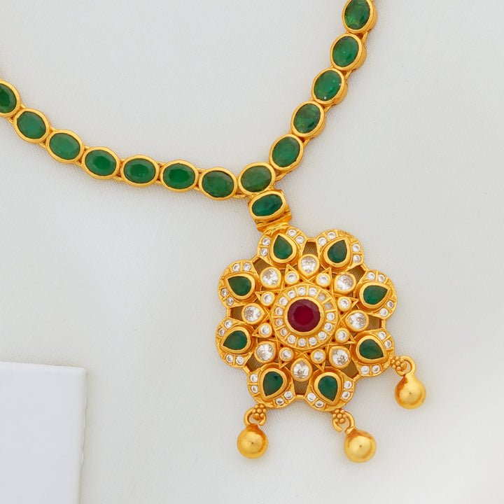 South Indian green stone necklace with gold-plated floral charm