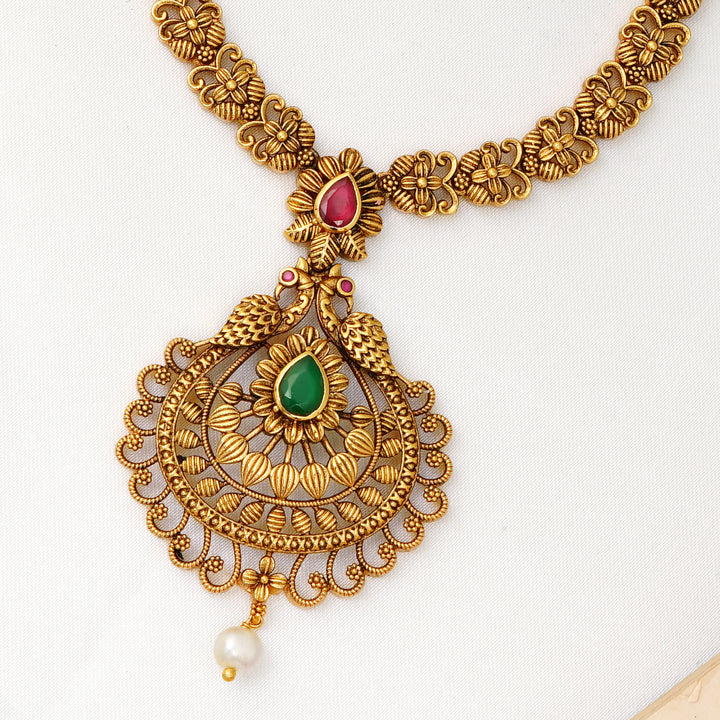 South Indian temple jewellery necklace featuring ruby, emerald, and pearl drop pendant