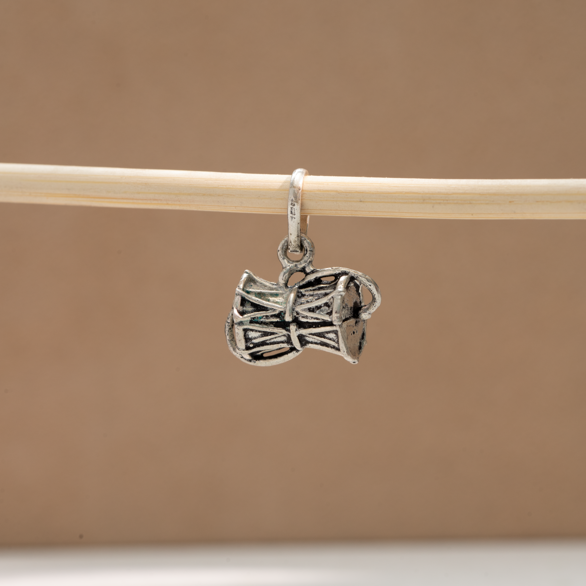 Sterling silver damaru pendant