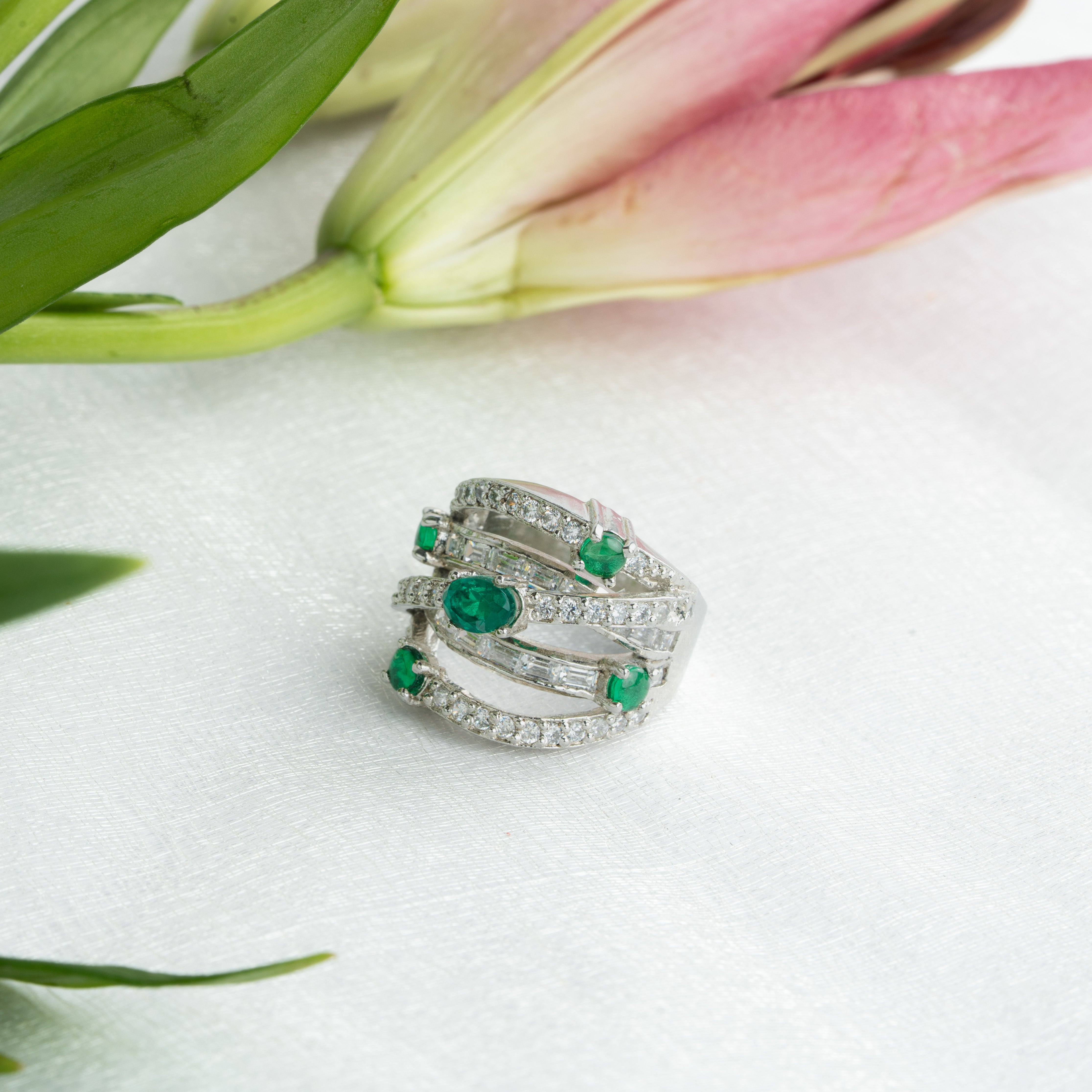 Sterling silver ring with emerald-green stones