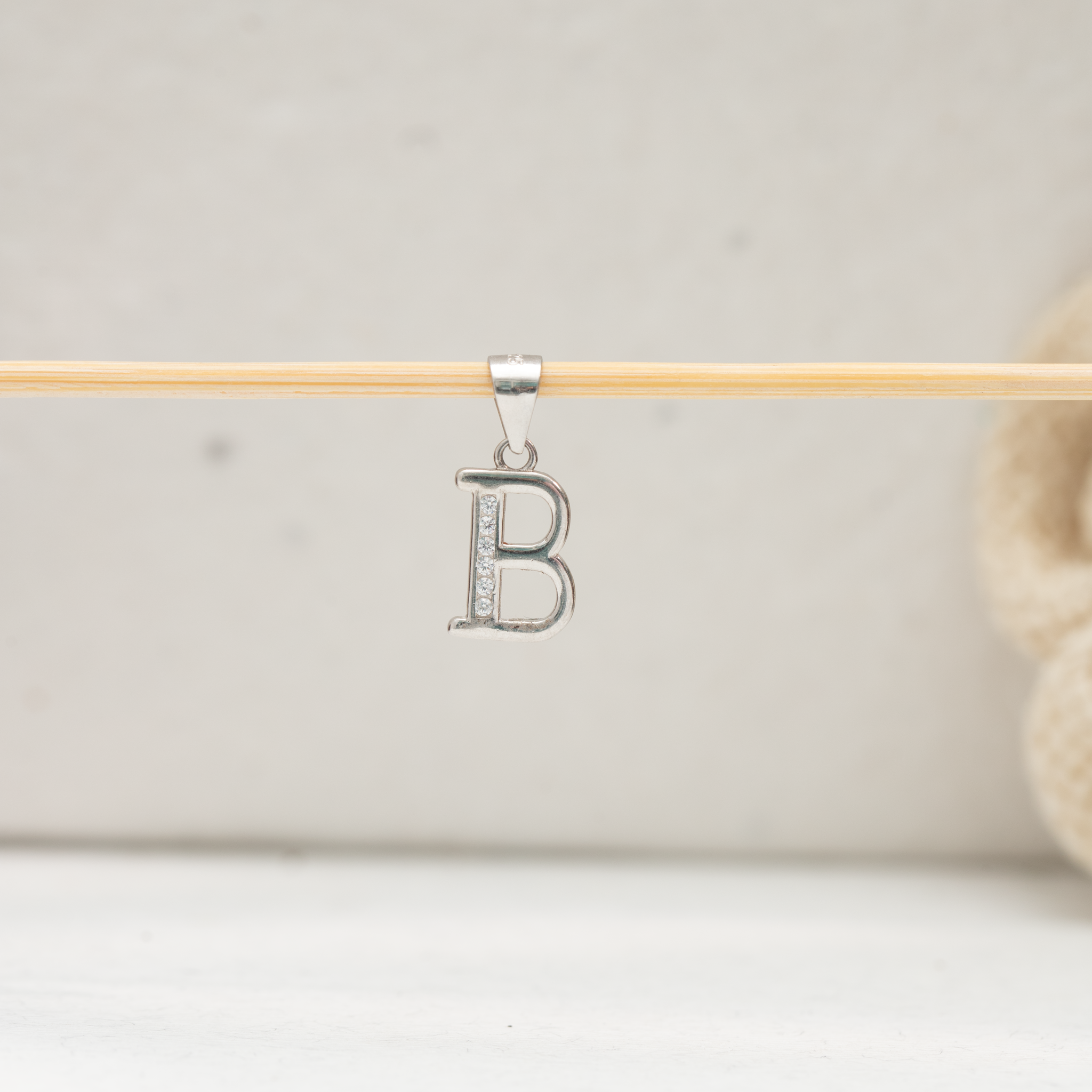 Stone studded alphabet B silver pendant