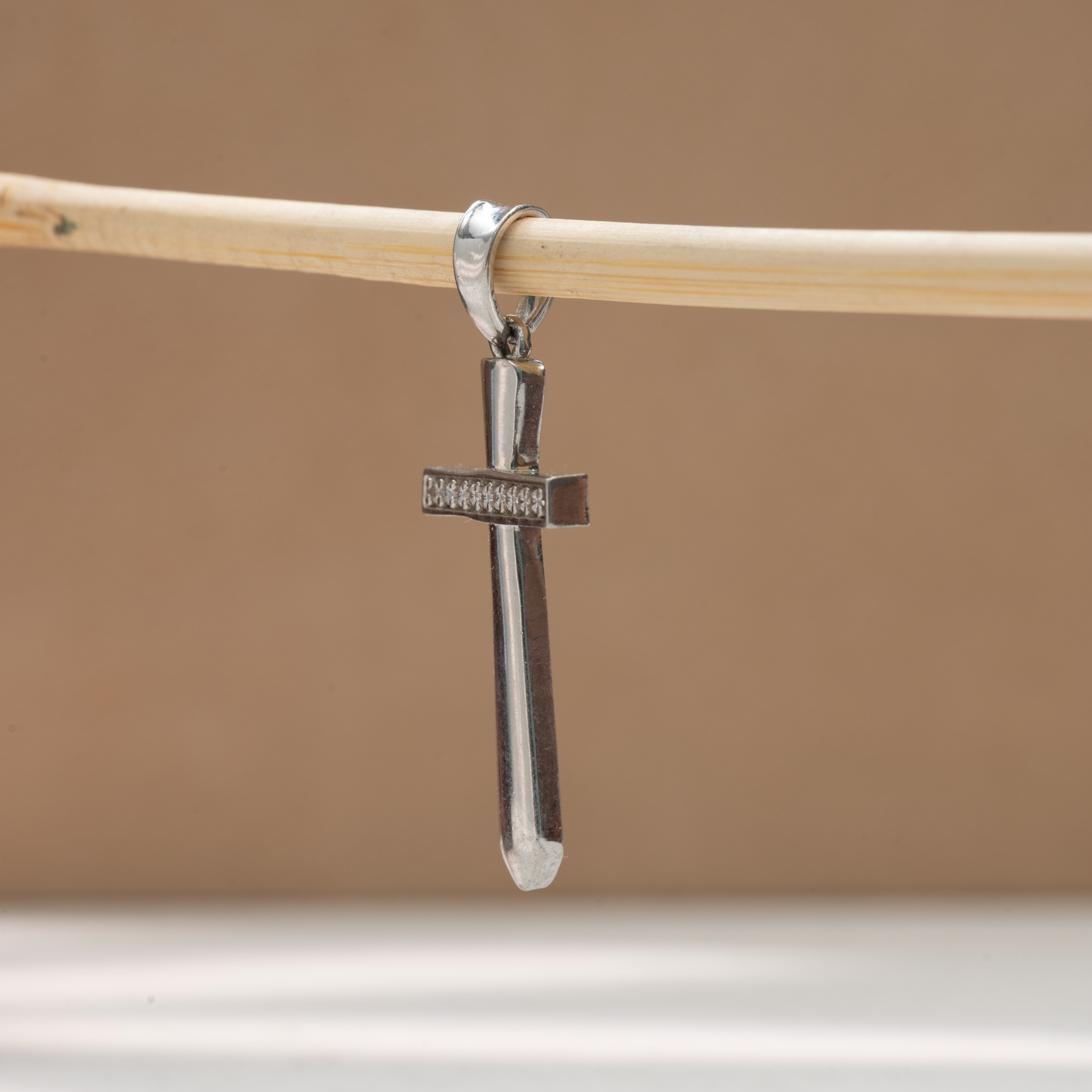 Stone studded silver cross pendant