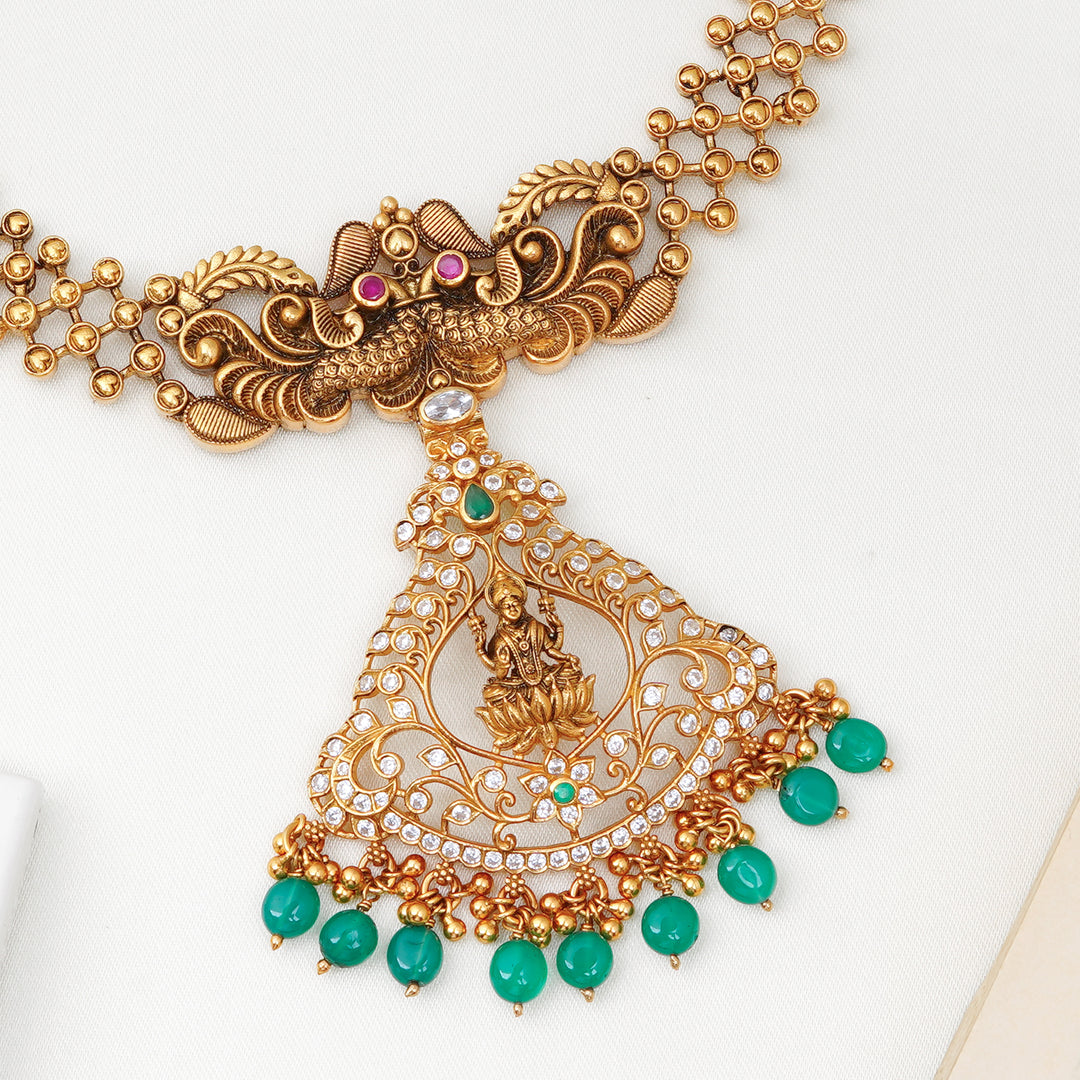 Temple-style Lakshmi necklace with green beads and filigree work