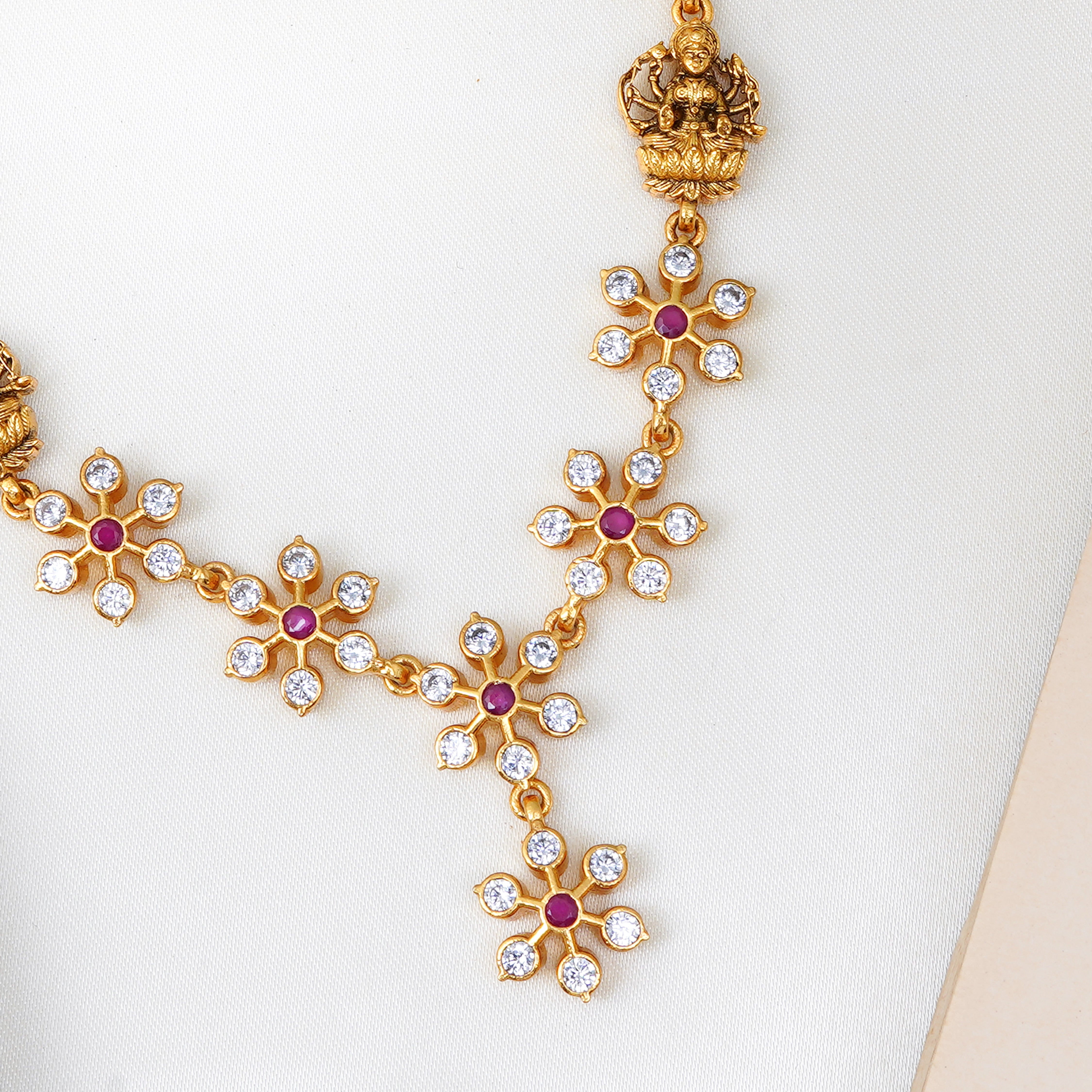 Temple jewellery necklace with ruby floral design