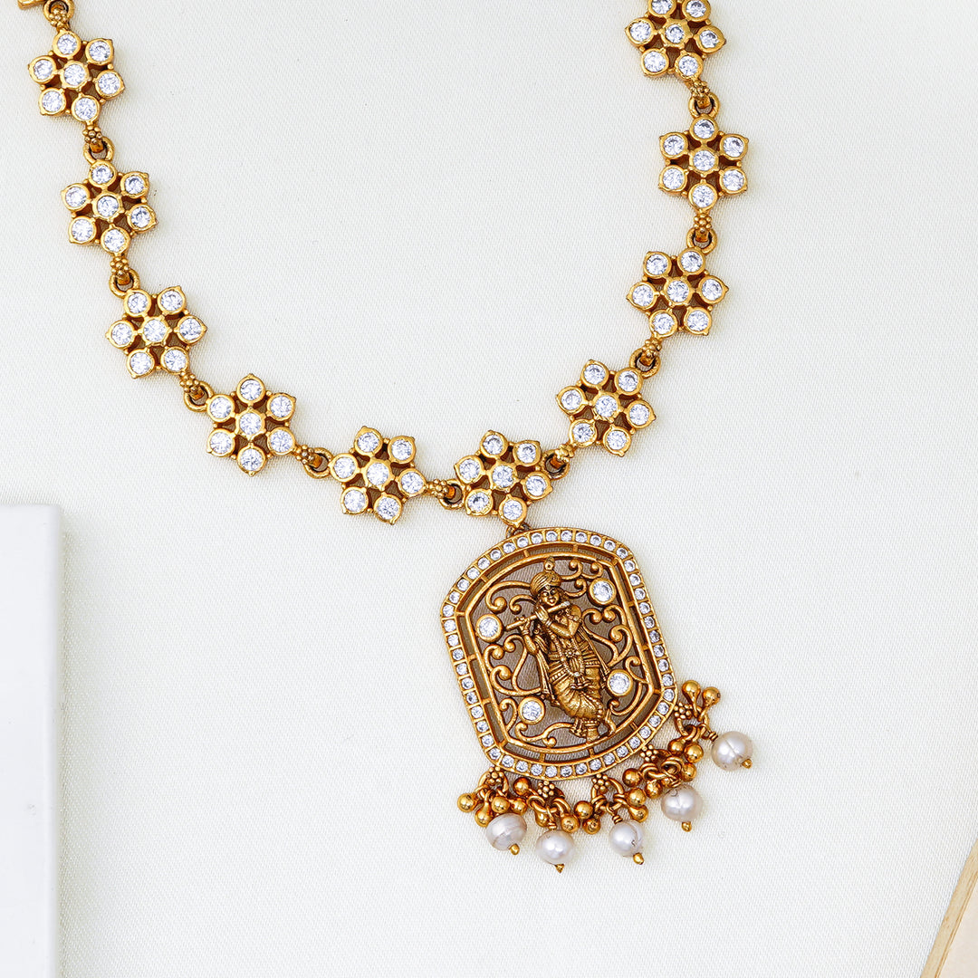 Temple jewellery style gold necklace with engraved pendant and Swarovski crystals