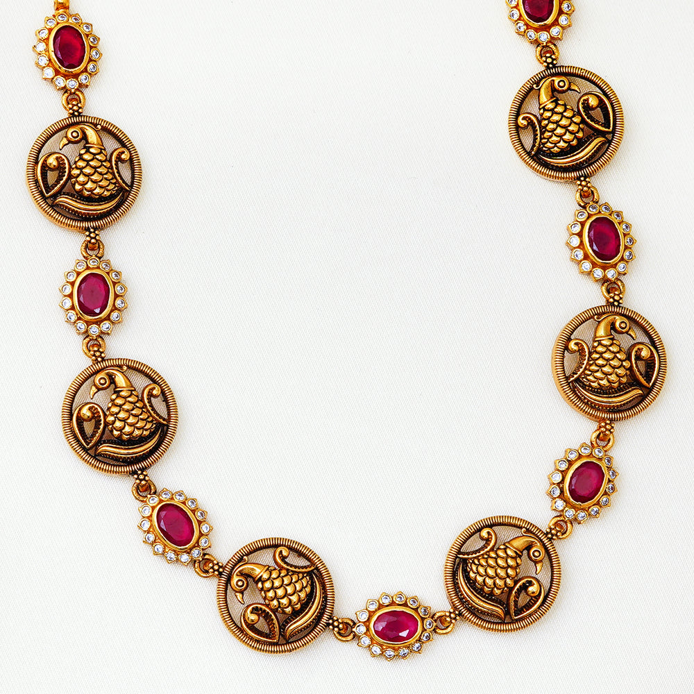 Traditional Indian peacock motif necklace with red stones