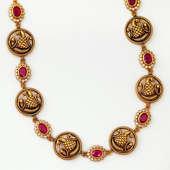 Traditional Indian peacock motif necklace with red stones