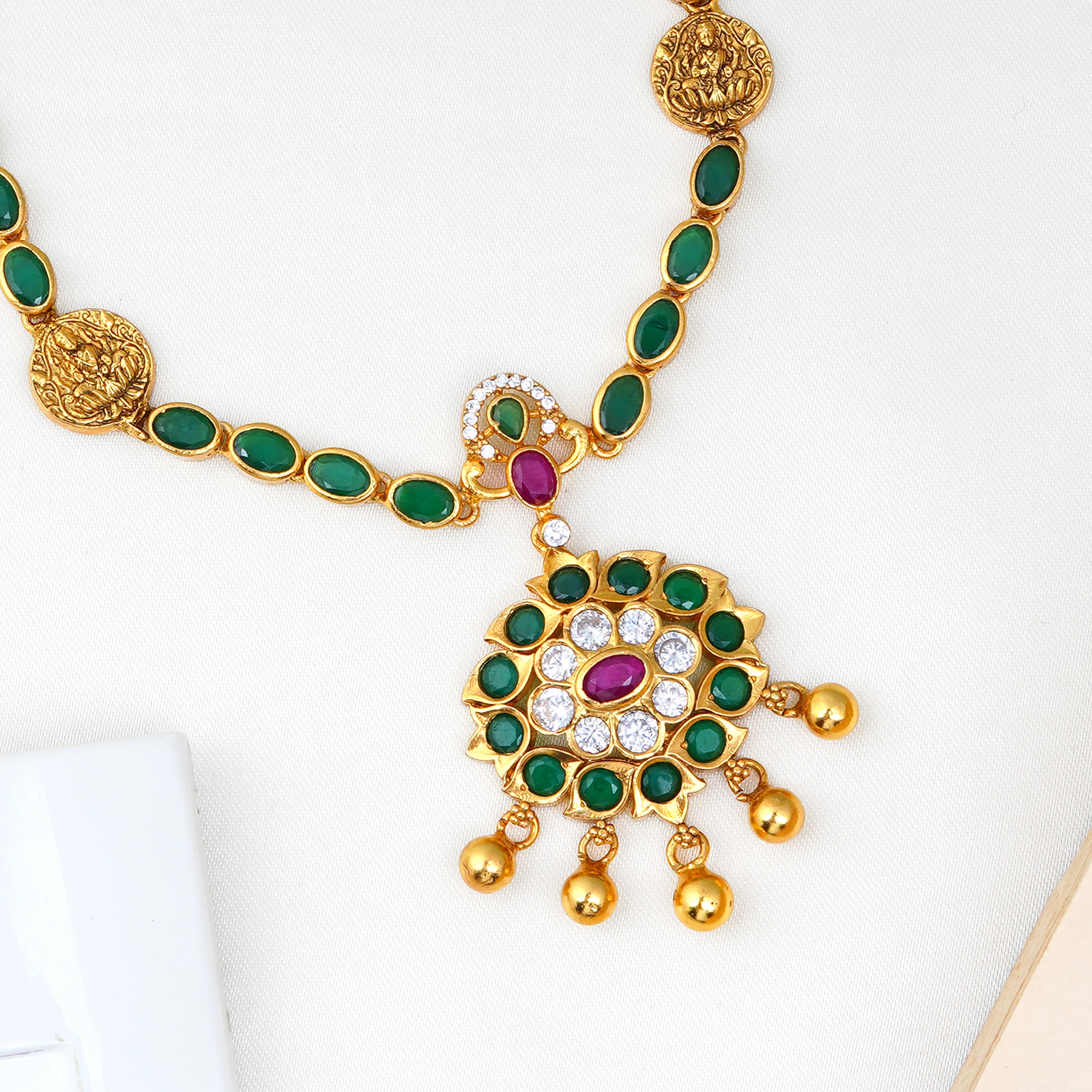 Traditional Lakshmi pendant necklace with emerald gems