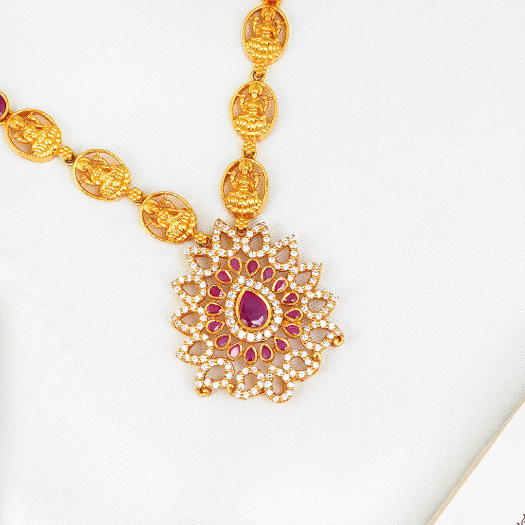 Traditional South Indian bridal necklace with ruby stones and goddess pendant
