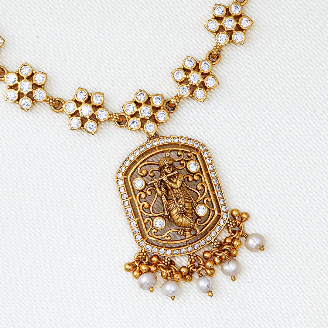 Traditional floral necklace with handcrafted Nakshi pendant and pearl hangings