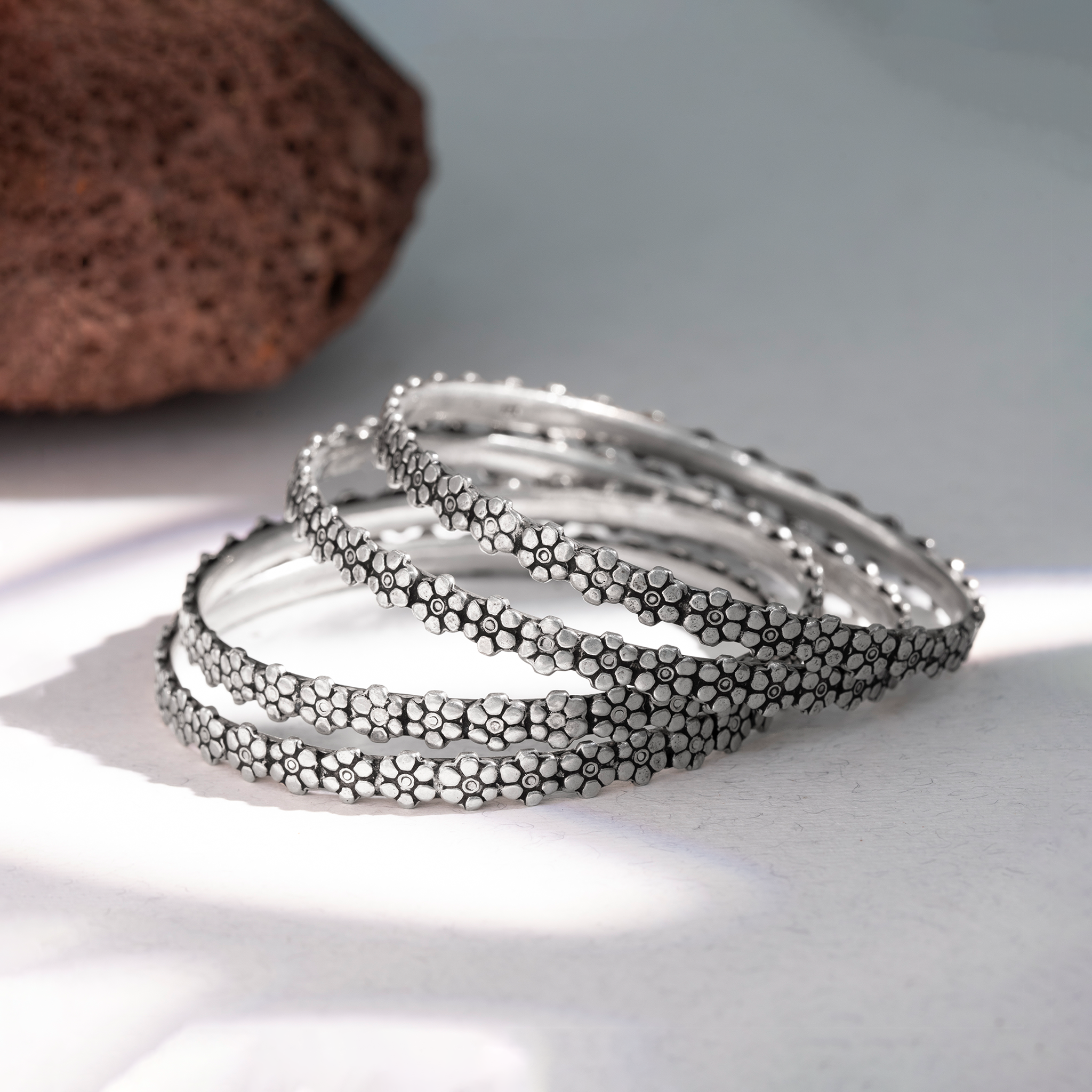 Traditional flower design silver bangles
