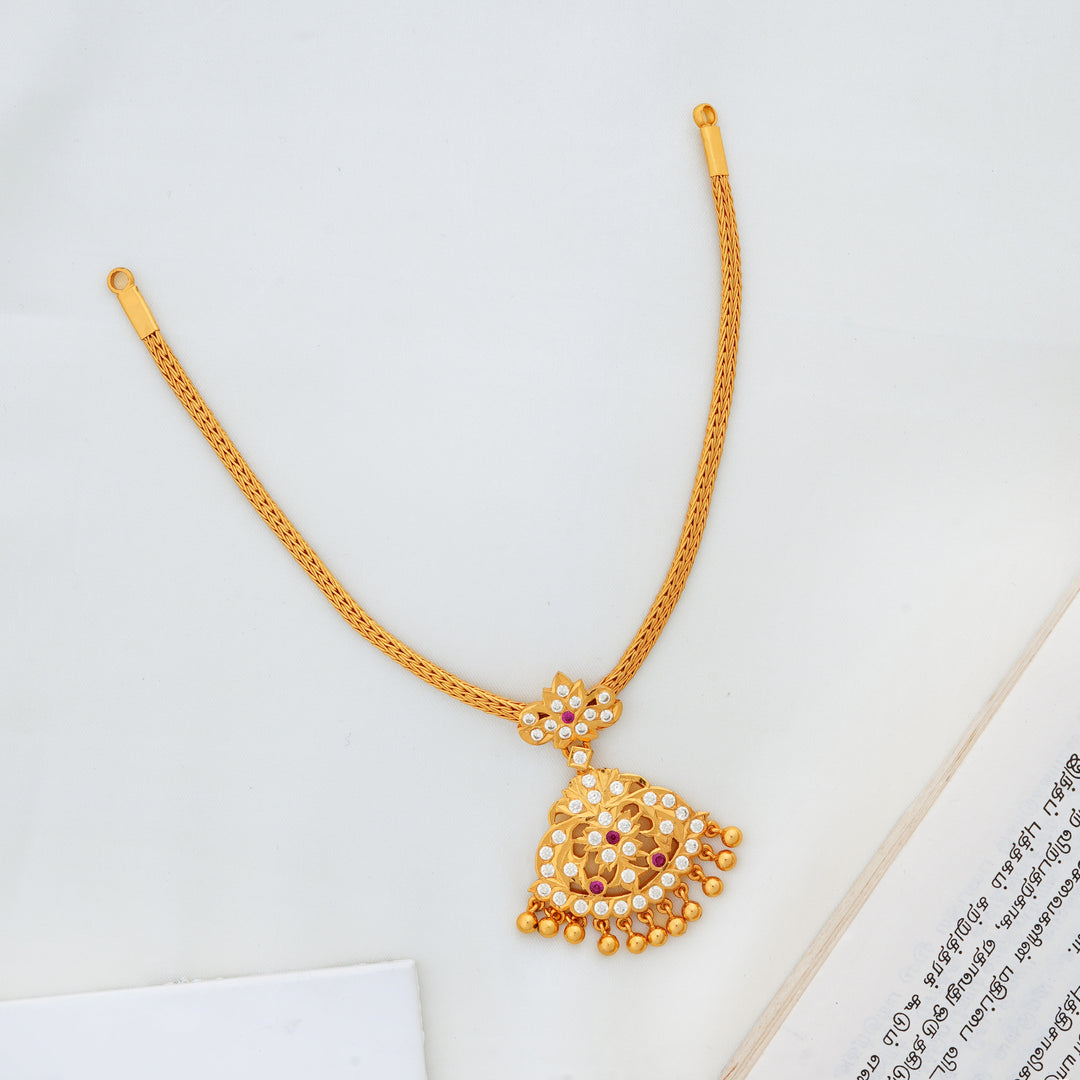 Traditional gold Attigai necklace with stone-studded pendant