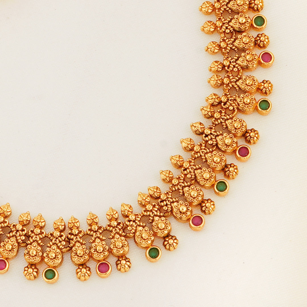 Traditional gold plated necklace set with ruby and emerald stones
