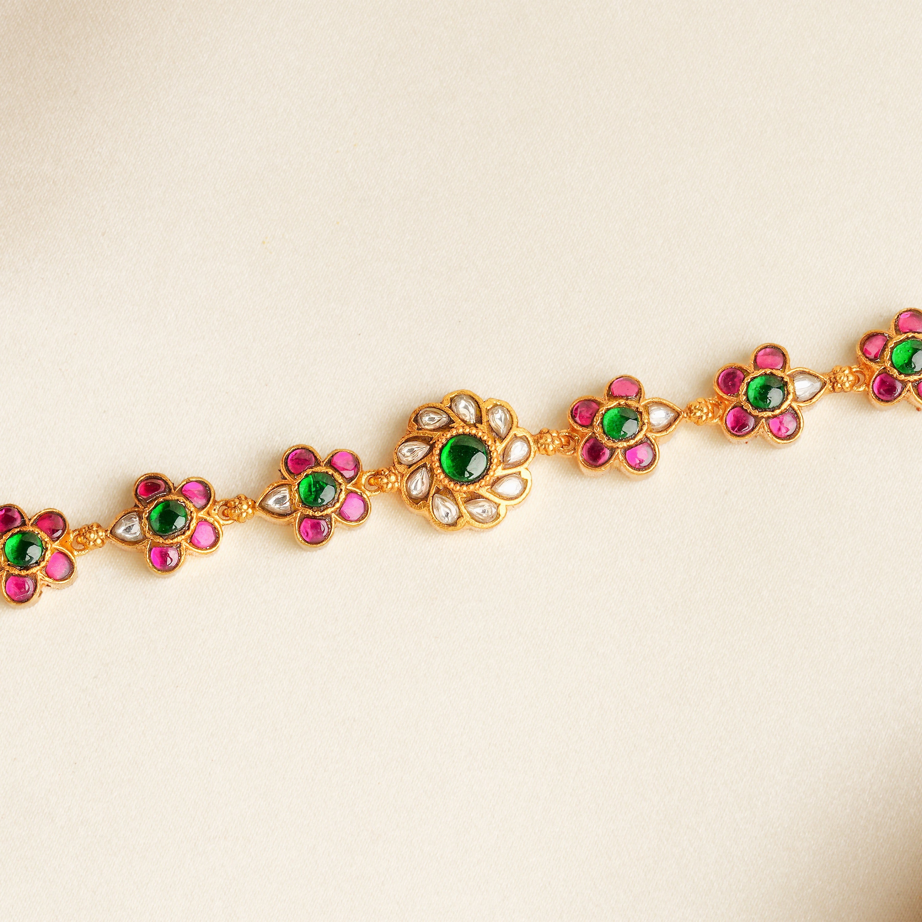 Traditional kundan bracelet with ruby and green stones