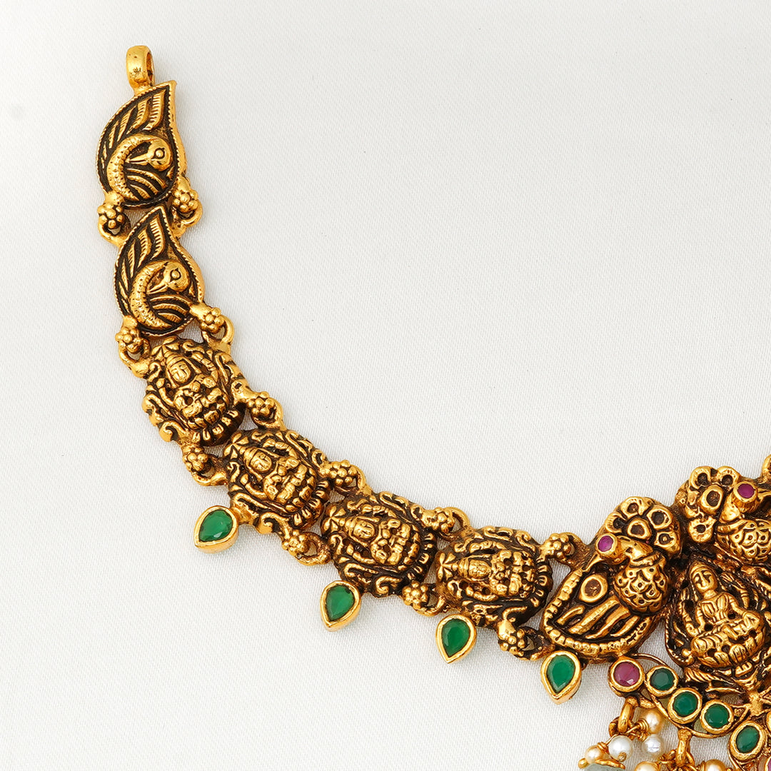 Traditional short temple jewellery with goddess Lakshmi and pearls