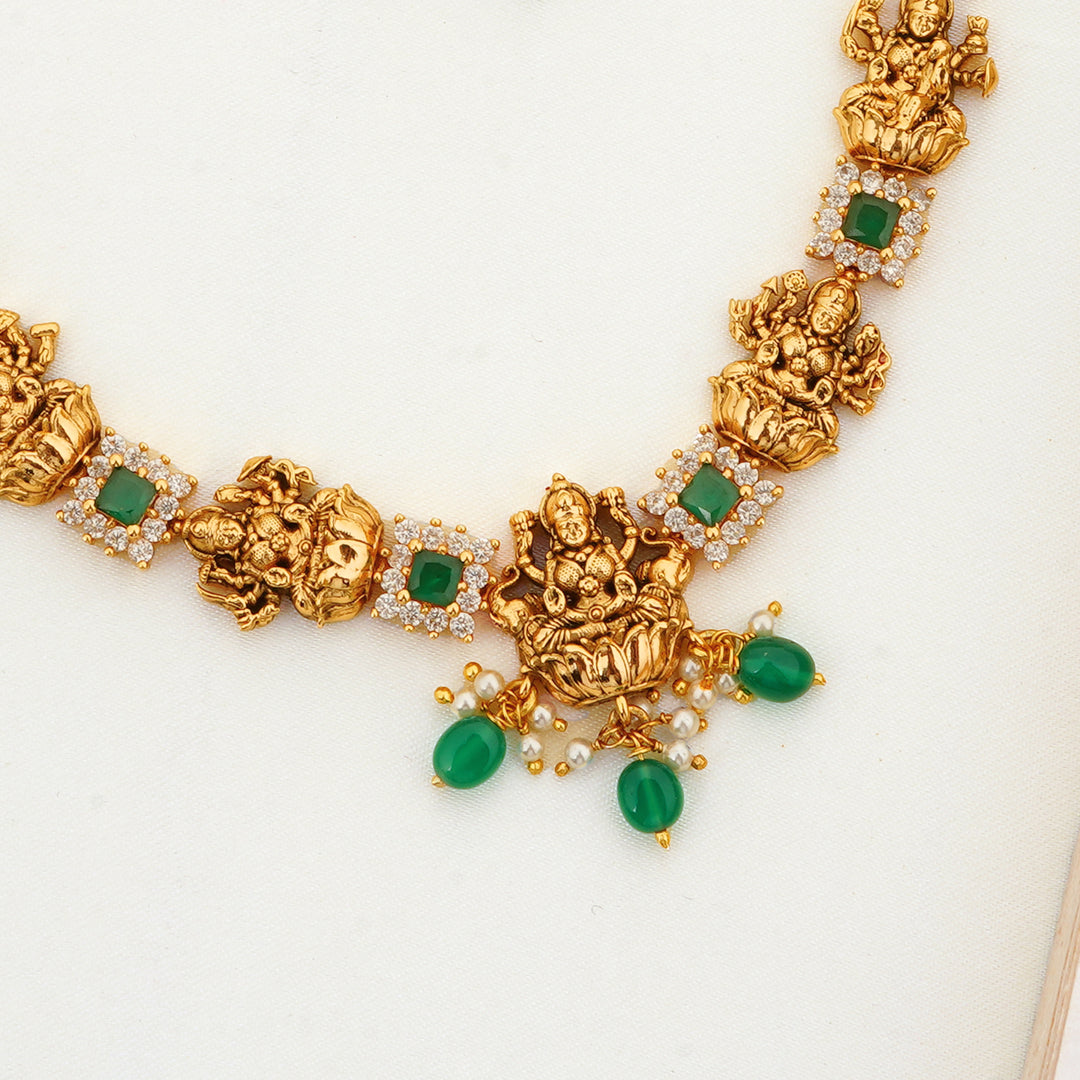 Wedding Jewellery Set with Lakshmi Motifs and Emerald Stones