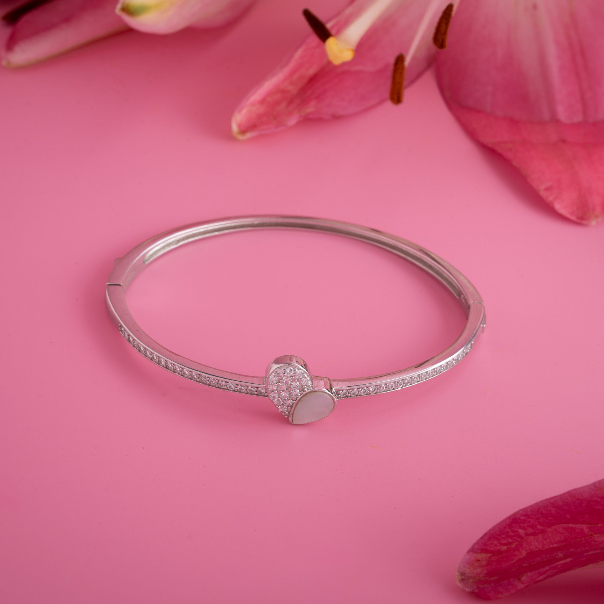 Women’s silver bangle with heart charm