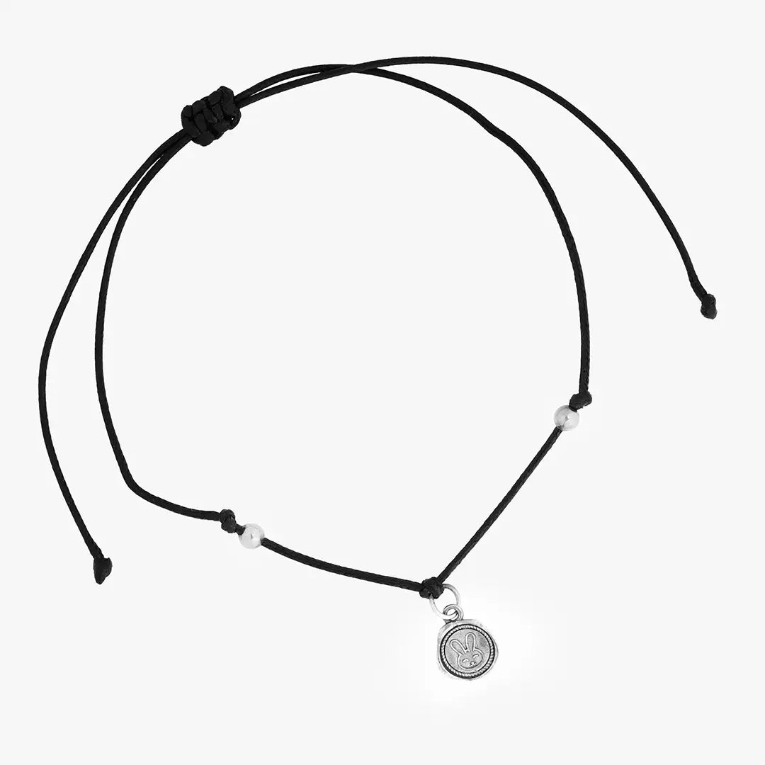 black thread bracelet with silver charm