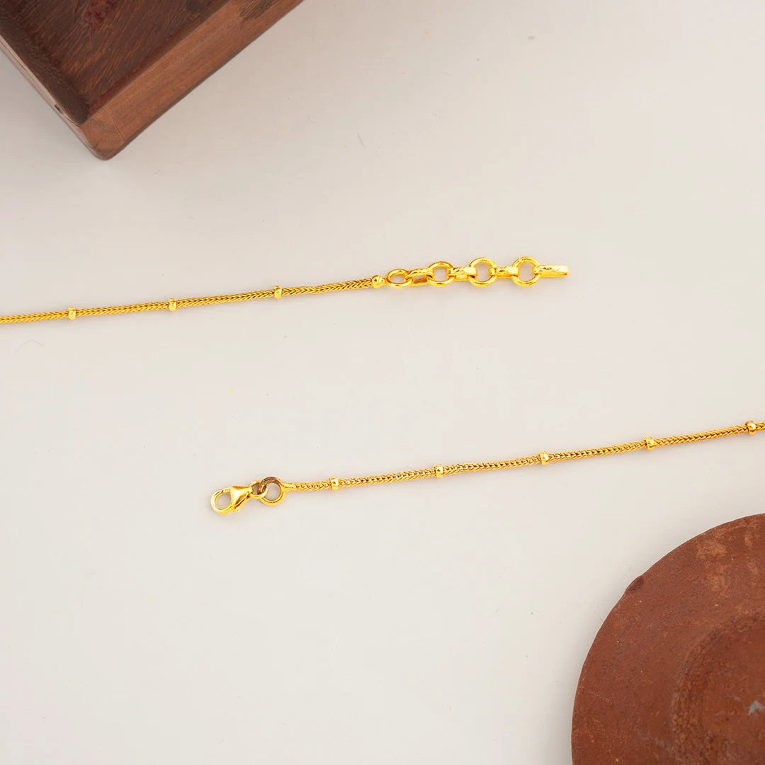 gold anklet with pink and green stones