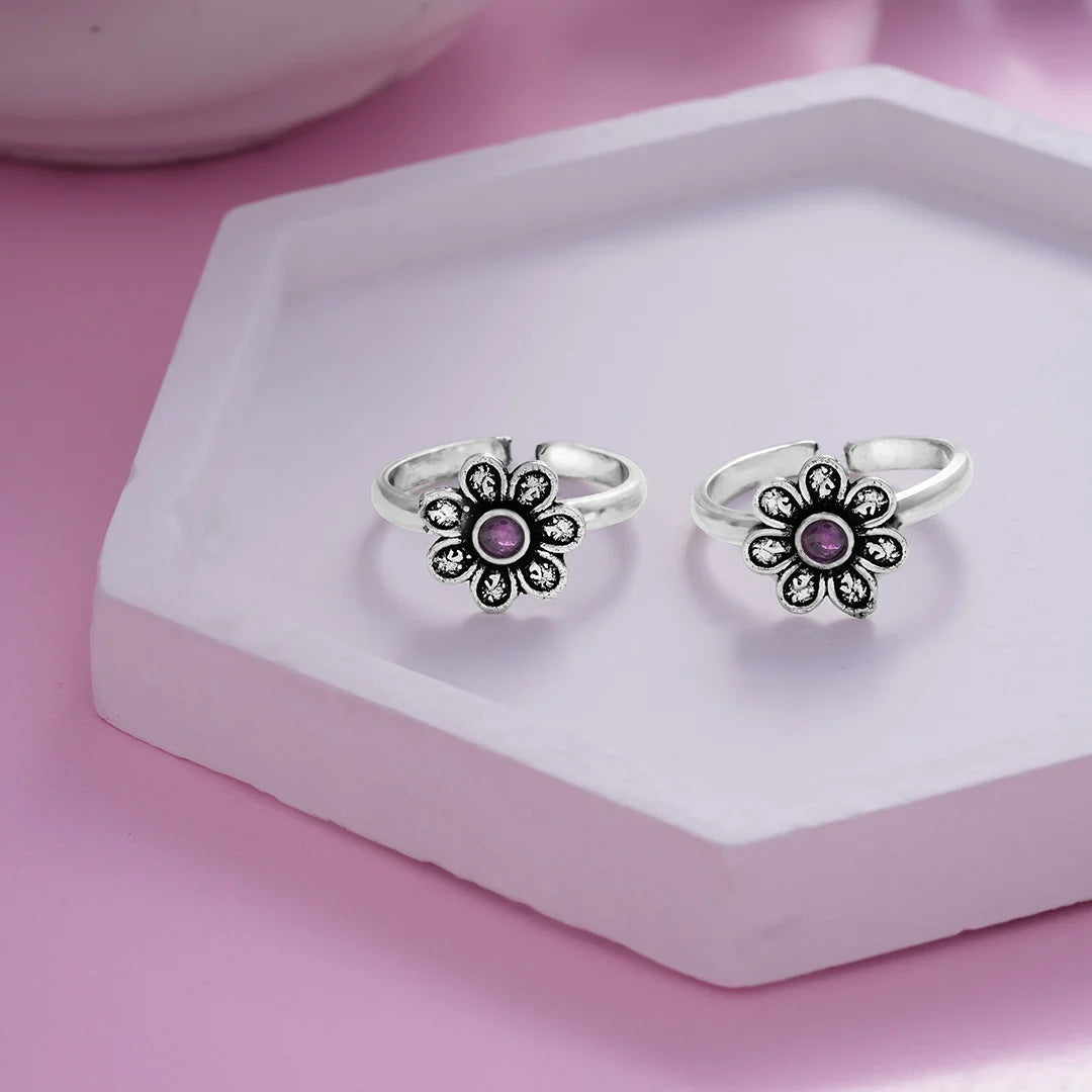 oxidised floral silver detailing with purple centre stone  