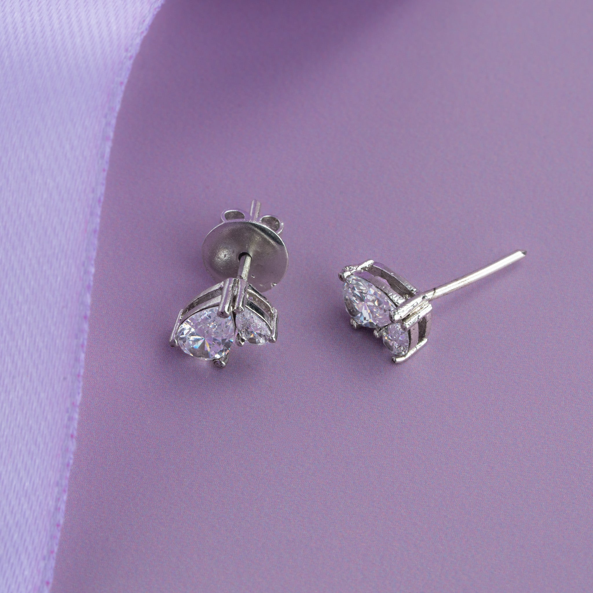 pear and round cubic silver stud