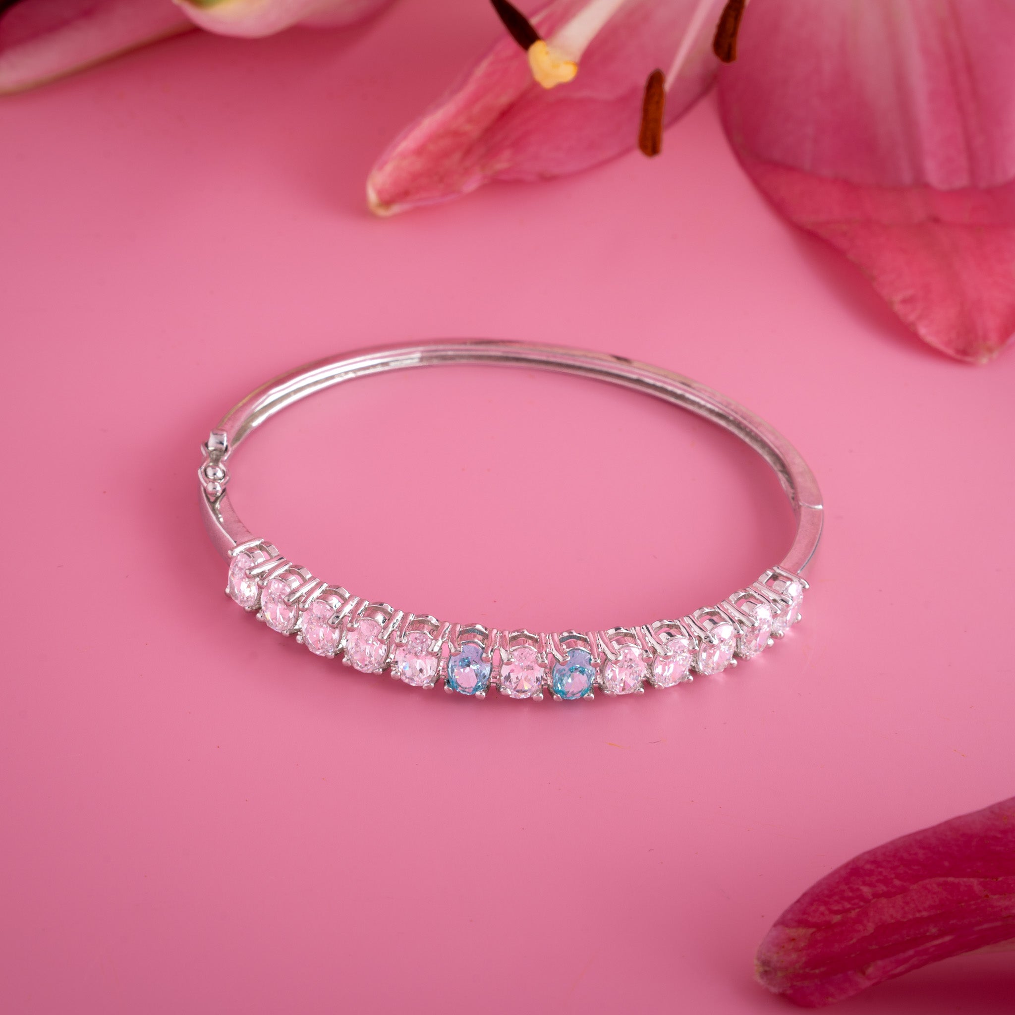 silver bangle with blue accent stones