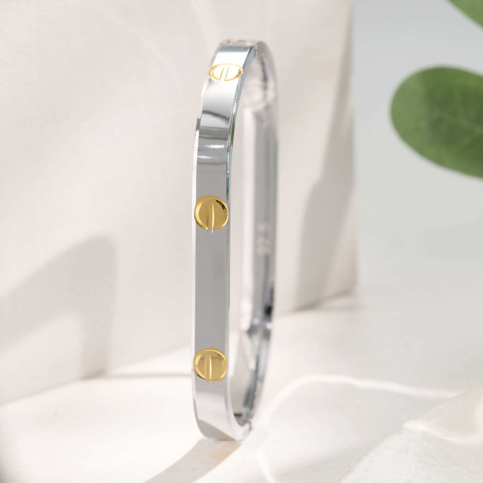 silver kada with gold screw design