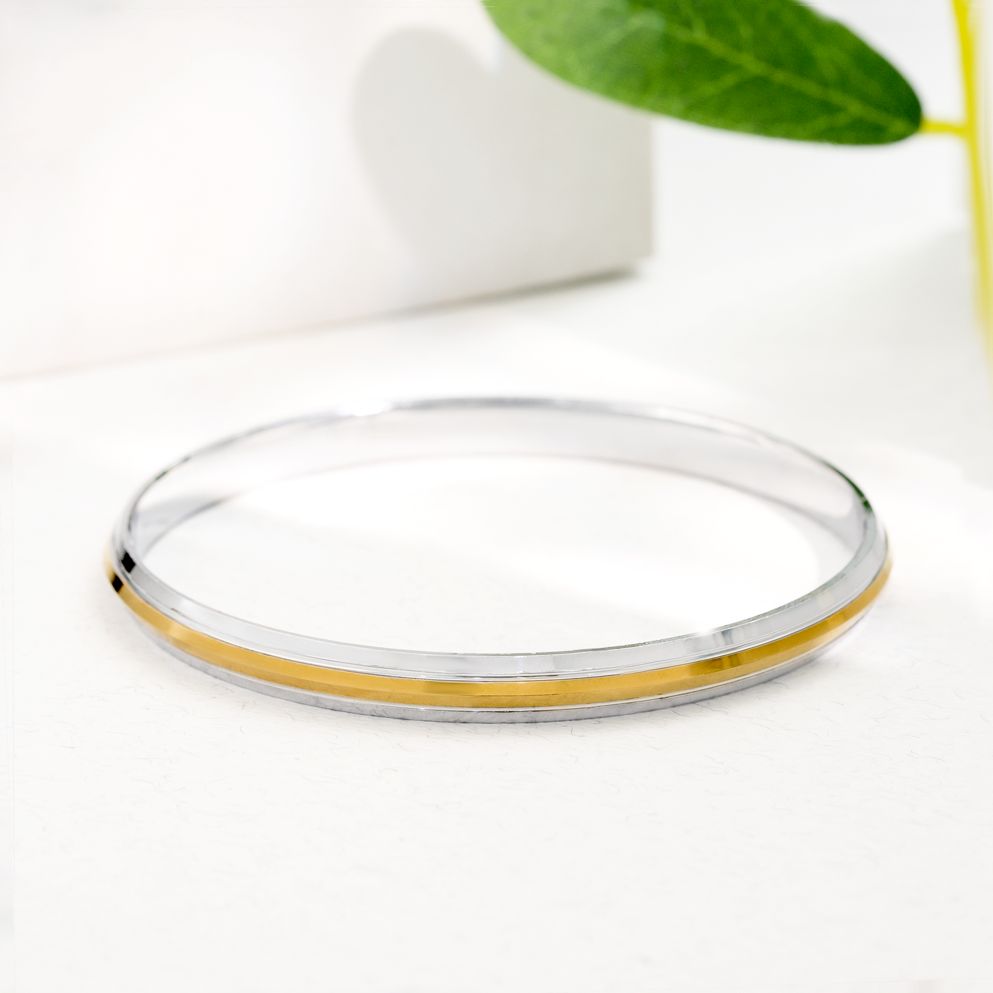 silver kada with gold stripe design