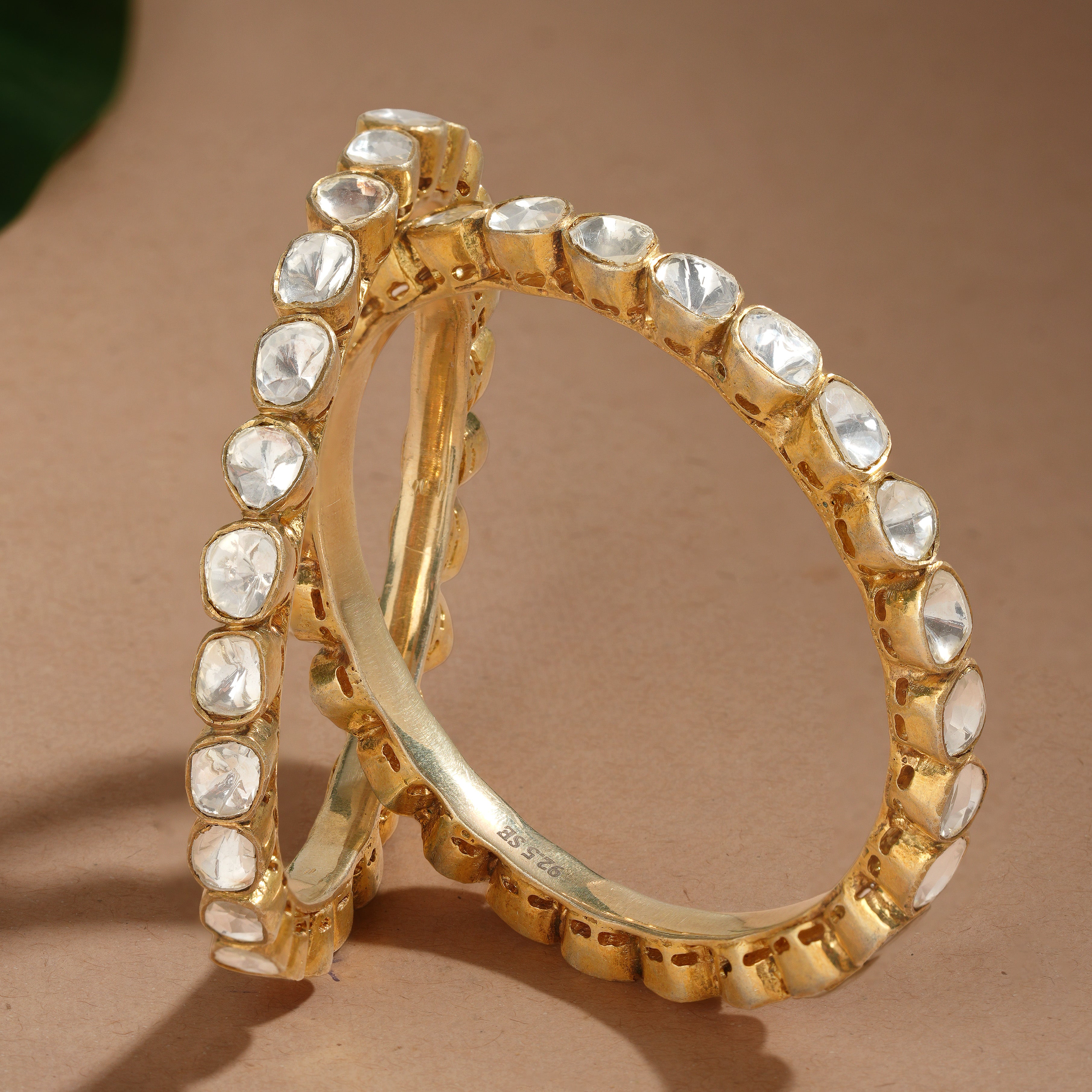 white stone round design bangle